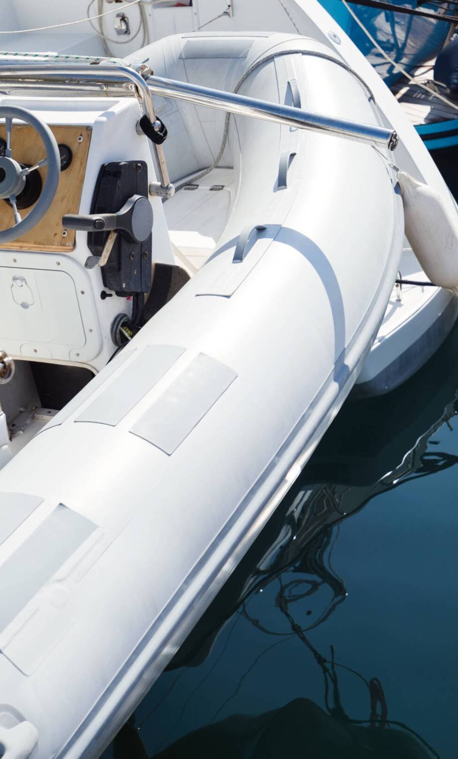 Picture of white rubber boat floating in harbor