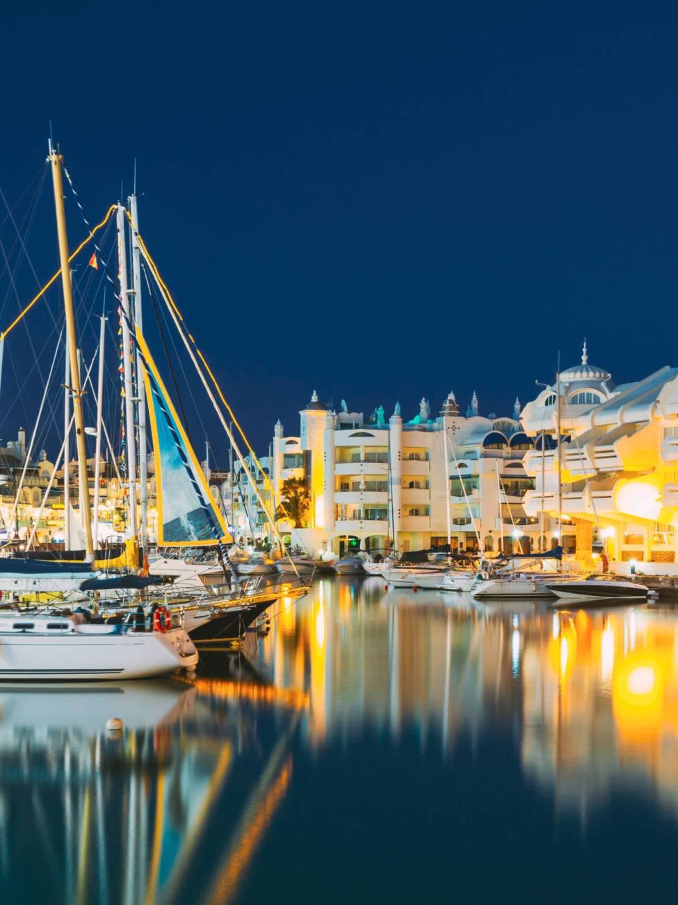 Benalmadena, Spain. Night Scenery View Of Floating Houses, Vessel In Puerto Marina. Malaga Region, On The Costa Del Sol. It Caters For A Large Number Of Tourists.
